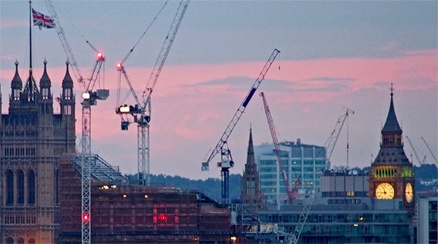London at dusk: cranes, flags and the Telecom Tower