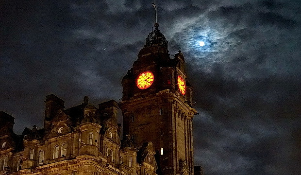 Wet streets, a big Moon and an illuminated station roof: Edinburgh night photos