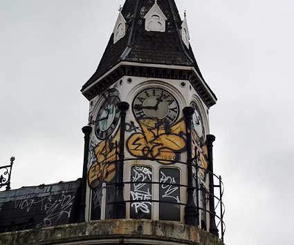 Graffiti on clocktower, Bradys Bar/ Railway Hotel, Atlantic Road, Brixton, London