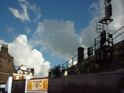 Railway Bridge and Garage sign,Ferndale Road, Brixton, Lambeth, south London