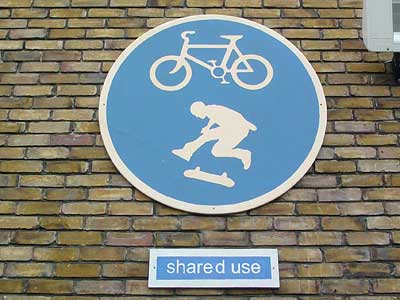 Cycles and skateboards sign by Brixton Cycles, near Stockwell Skate Park, Brixton, Lambeth, London, England SW9