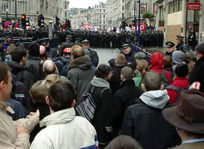 Protesters, police and rain