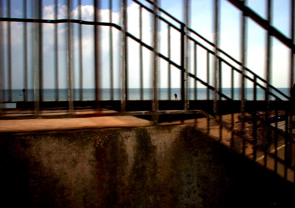 Lone bather from a train, Teignmouth beach, Devon