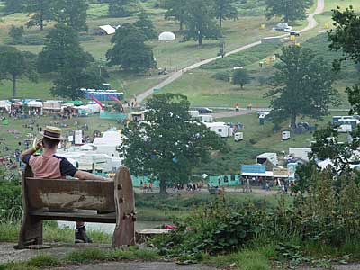 Man with straw boater and phone, Big Chill festival, Eastnor Castle 2004, England UK