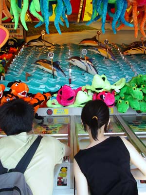 Racing the dolphins, Palace Pier amusement arcade, Brighton, May 2003
