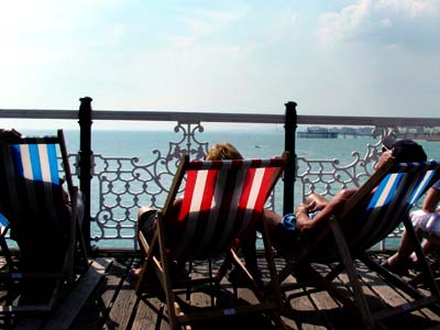 Soaking up the sun, Palace Pier, May 2003