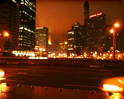 Rain, streetlamps, skyscrapers