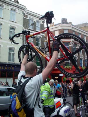 Bike held aloft, Duke of York, Clerkenwell Road, Critical mass bike ride, London, 27th June 2003