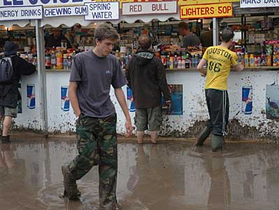 Shopping in the rain, Glastonbury Festival, Pilton, Somerset, England June 2005
