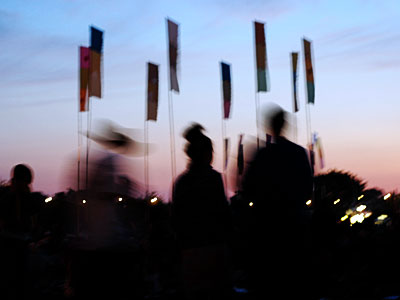 Flags at dusk, Jazz World, Glastonbury Festival, Pilton, Somerset, England June 2005