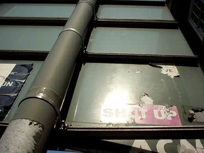 Street sign and stickers, Euston Rd