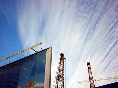 Winter clouds, cranes and billboard
