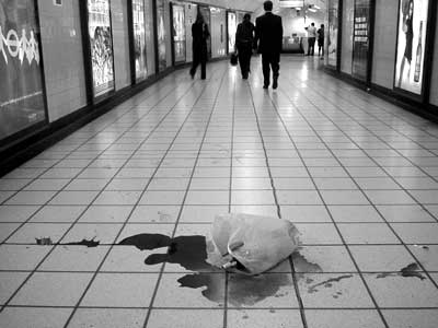 Broken bottle, Oxford Circus tube station at night London