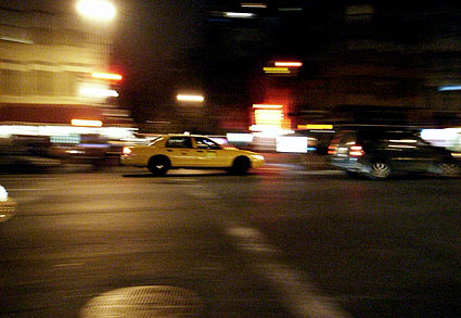 Speeding cab. Night photographs on the streets of New York, NYC, December 2006