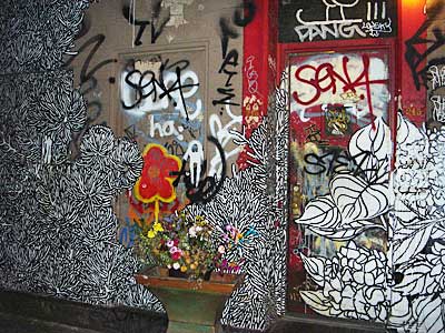Painted doorway, Ave C, Le Petit Versailles, 46 East Houston St. between Avenue B and C in the East Village, Manhattan, New York, NYC, USA