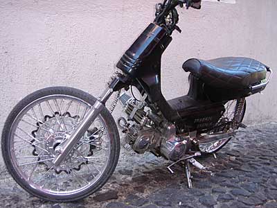 Souped up moped by Lava Internet Cafe, Fira, Santorini, Greece, September 2004
