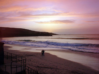 Sunset over Porthmeor Bay, St Ives harbour, St Ives, Cornwall
