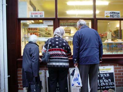 Looking at the pasties, Fore Street, St Ives, Cornwall, March 2003