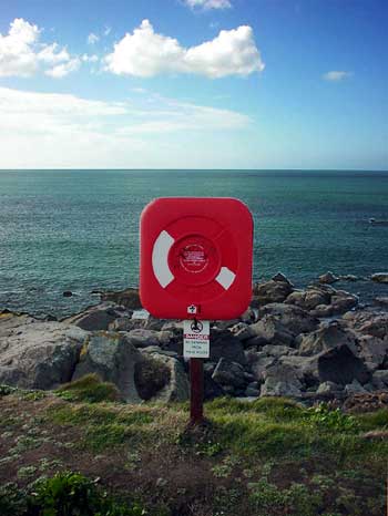 lifebelt, rocks and sea, St Ives, Cornwall